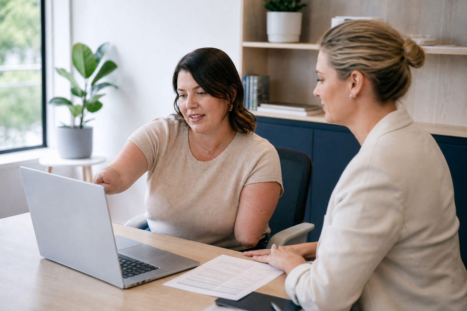 Female NDIS participant reviewing job options with a career counsellor
